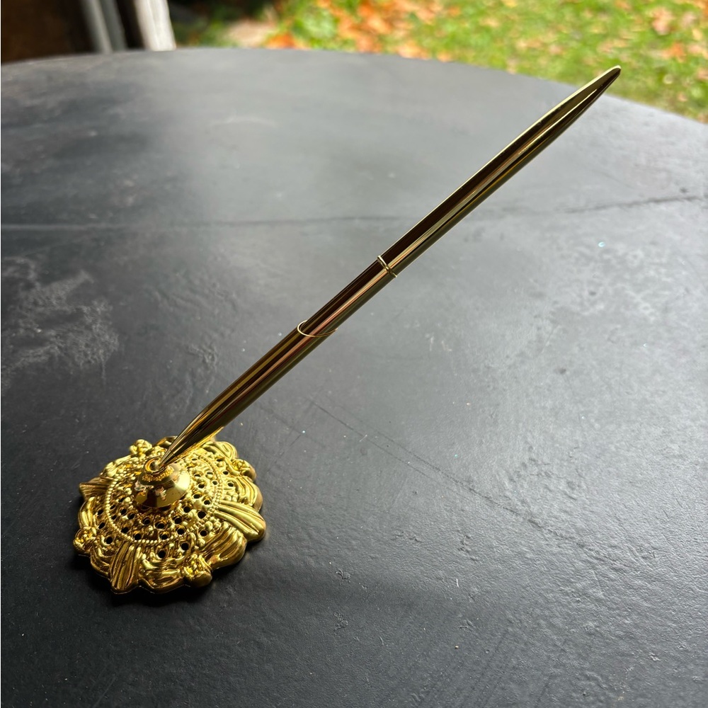 Luxurious Gold Pen with Decorative Base